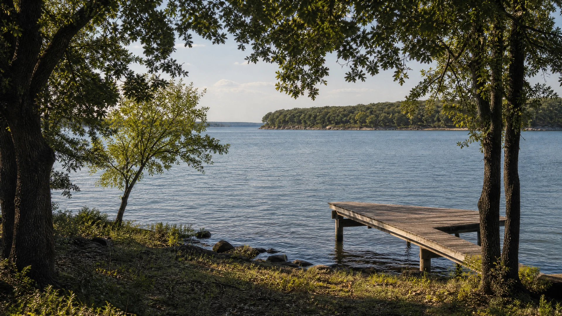 Illustrative wooden dock at Lake Texoma facing calm water and a distant natural shoreline